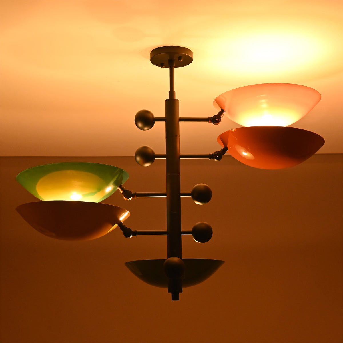 Front view of Arcadia Multi Bowl Chandelier with colorful bowl shades and sculptural central column design.