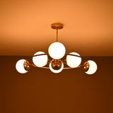 Side view of Aria Orbit Globe Chandelier with six illuminated globes and compact circular ceiling light profile.