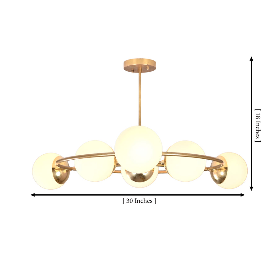 Aria Orbit Globe Chandelier above dining table in modern room with warm ambient lighting and globe shades.