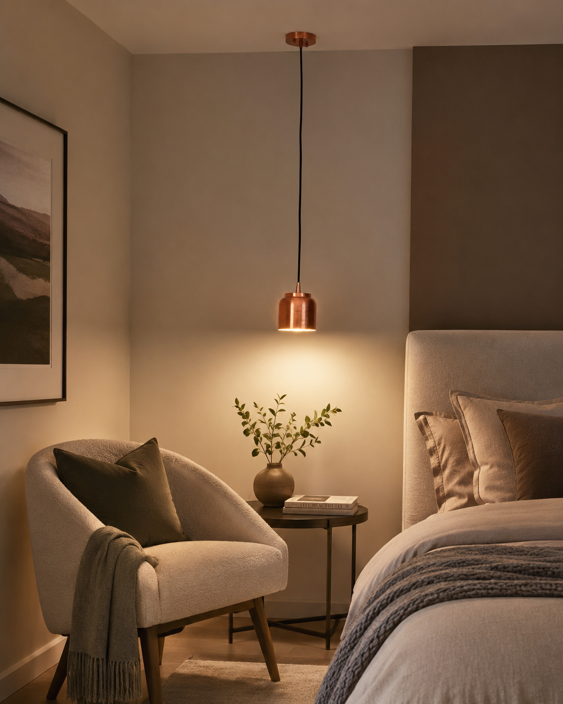 Aspen copper cylinder pendant light installed beside a modern bedroom, providing warm focused lighting above a bedside table in a contemporary interior.