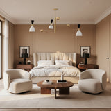 Aspen 6 light Mid-Century Modern chandelier shown from an alternate view highlighting its sculptural brass-tone arms and two-tone cone shades.
