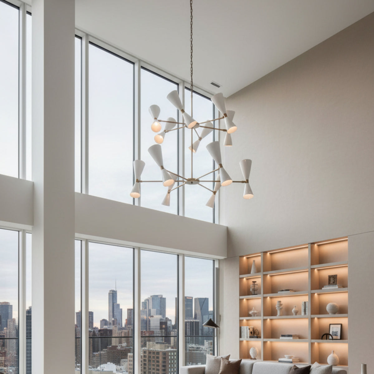Auckland 24 light two-tier chandelier shown from the front with white double-cone shades, brass-tone radial arms, and chain suspension.