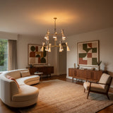 Auckland 24 light chandelier shown illuminated with white double-cone shades and a sculptural two-tier brass-tone frame.