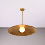 Angled view of Aurelia Globe Saucer Pendant Light showing broad saucer shade and slim ceiling rod.