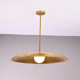 Front view of Aurelia Globe Saucer Pendant Light with wide dome shade and glowing globe bulb.