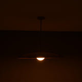 Side angle of Aurelia Petite Saucer Pendant Light highlighting the shallow dome profile and warm bulb glow.