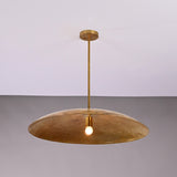 Aurelia Saucer Pendant Light with wide dome shade and single glowing bulb in front view.