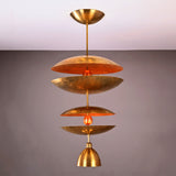 Aurelia Tiered Disc Chandelier shown on plain background with sculptural layered design and ceiling canopy.