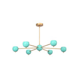 Full view of Aurora 6 light globe chandelier with turquoise shades, brass radial frame and round ceiling canopy