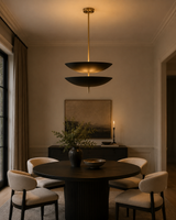 Aurora double bowl 6 light pendant chandelier installed above a round dining table in an elegant modern dining room, Model 62013