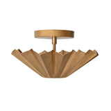 Angled front view of the Aurora Fluted Petal flush mount ceiling light showcasing its sculptural fluted brass shade and modern flush ceiling mount.
