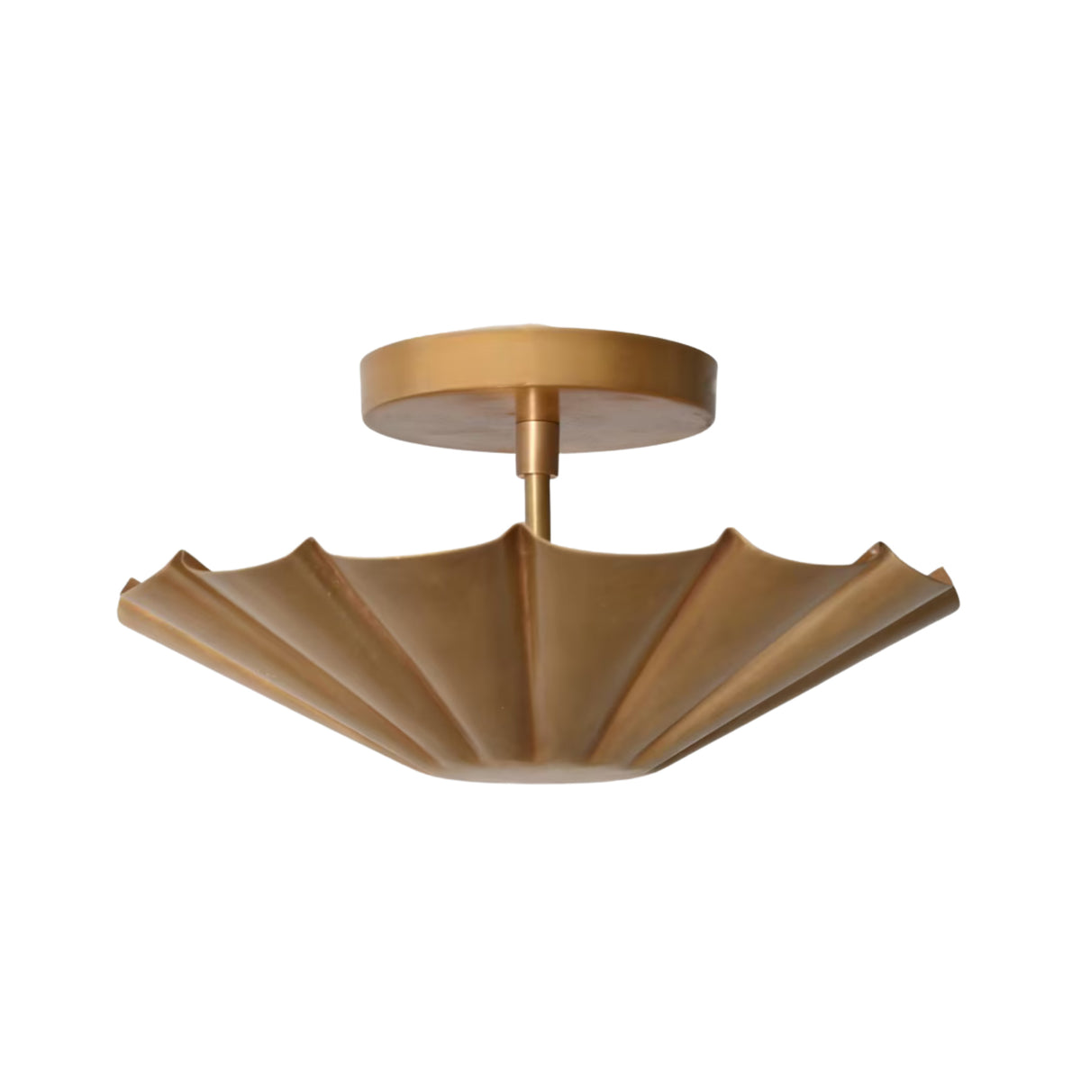 Angled view of the Aurora fluted scallop flush mount ceiling light showcasing its handcrafted brass fluted shade and elegant sculptural form.