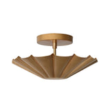 Angled view of the Aurora fluted scallop flush mount ceiling light showcasing its handcrafted brass fluted shade and elegant sculptural form.