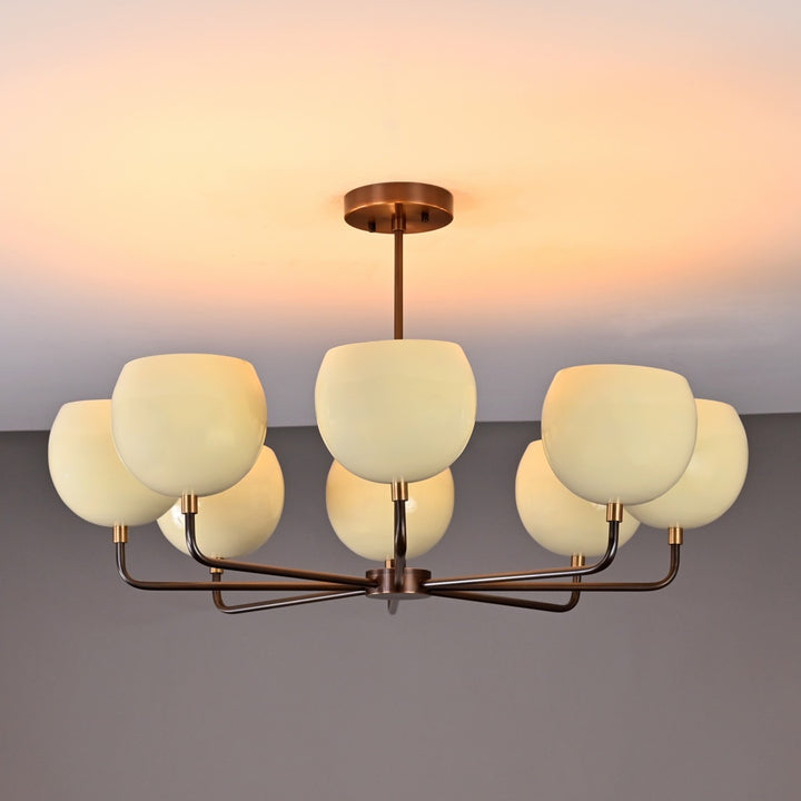 Elegant 8-light chandelier with cream glass globe shades and antique brass finish, ideal for living rooms, dining areas, or modern interiors
