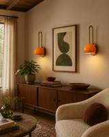 Pair of Aurora Loop Dome Wall Sconces installed above a wooden console in a warm Mid-Century Modern living room – Model 32831