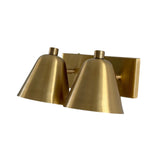 Front angled view of the Aurora satin brass dual-light wall sconce highlighting its handcrafted tapered shades and architectural design.
