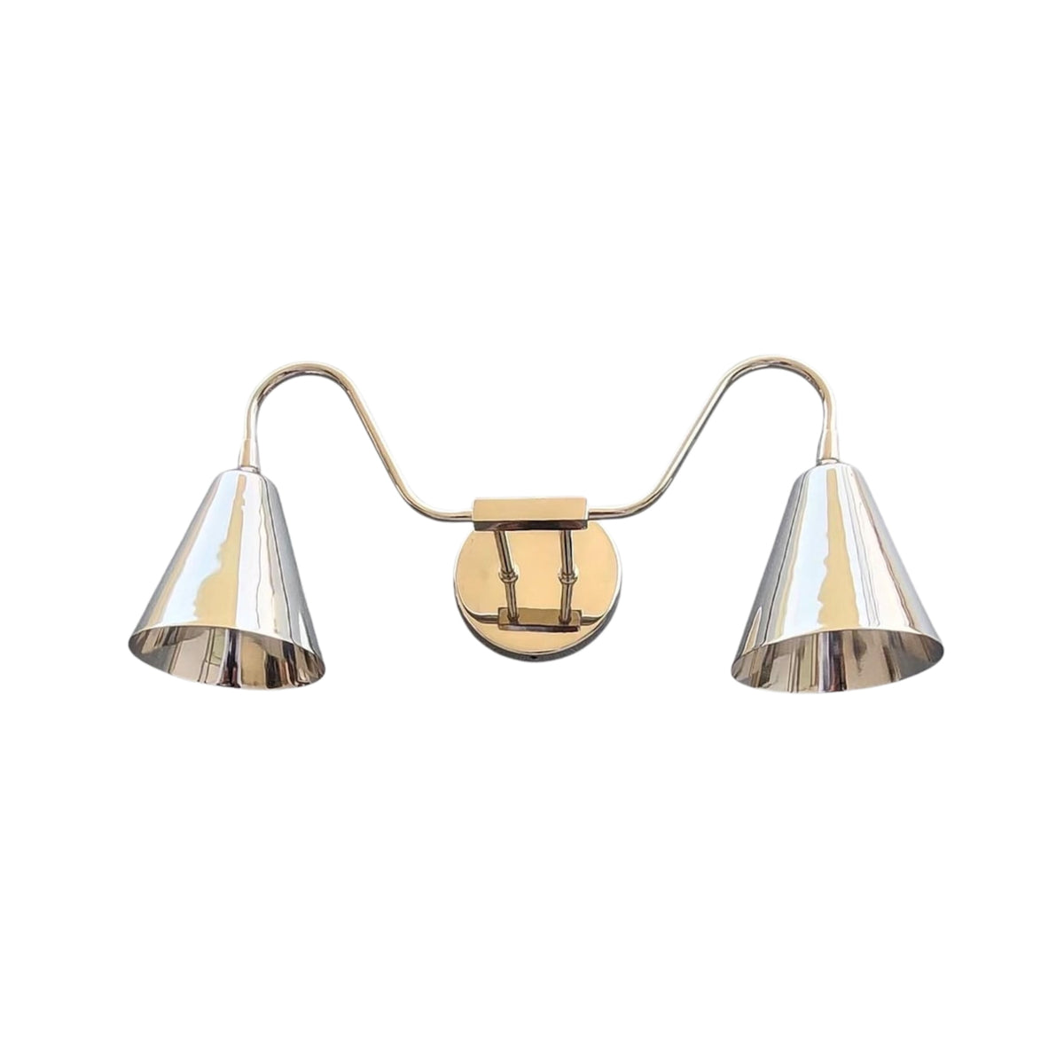 Front view of the Aurora modern satin brass double wall sconce featuring dual tapered metal shades, elegant curved arms, and a round wall backplate.