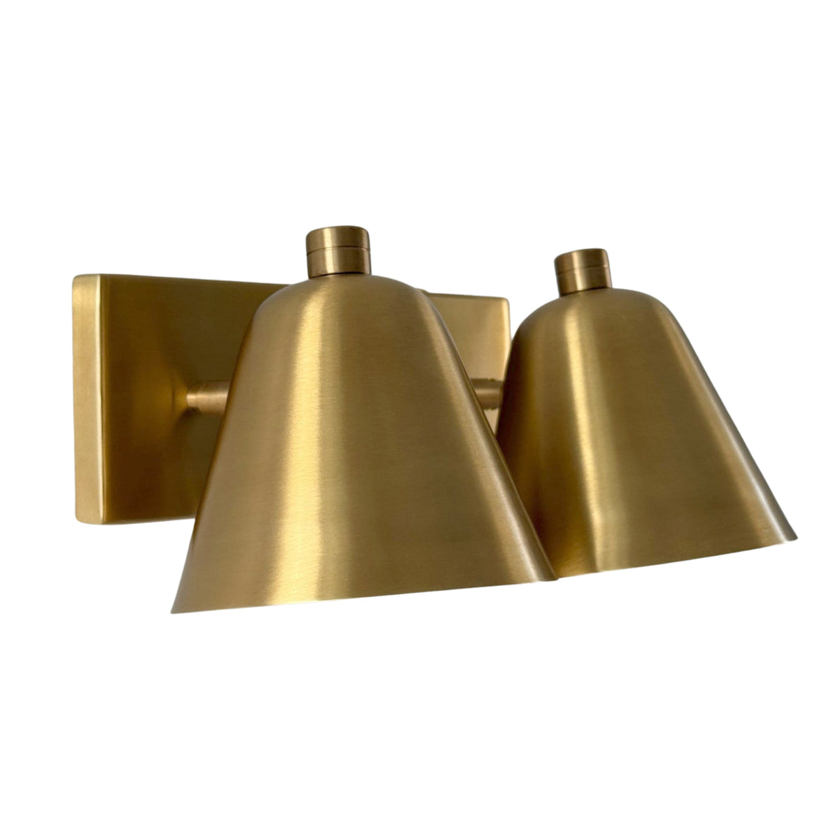 Left angled view of the Aurora satin brass double wall sconce showcasing two tapered shades and a minimalist rectangular backplate.