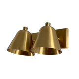 Opposite angled view of the Aurora modern satin brass double wall sconce featuring two downward-facing tapered shades.