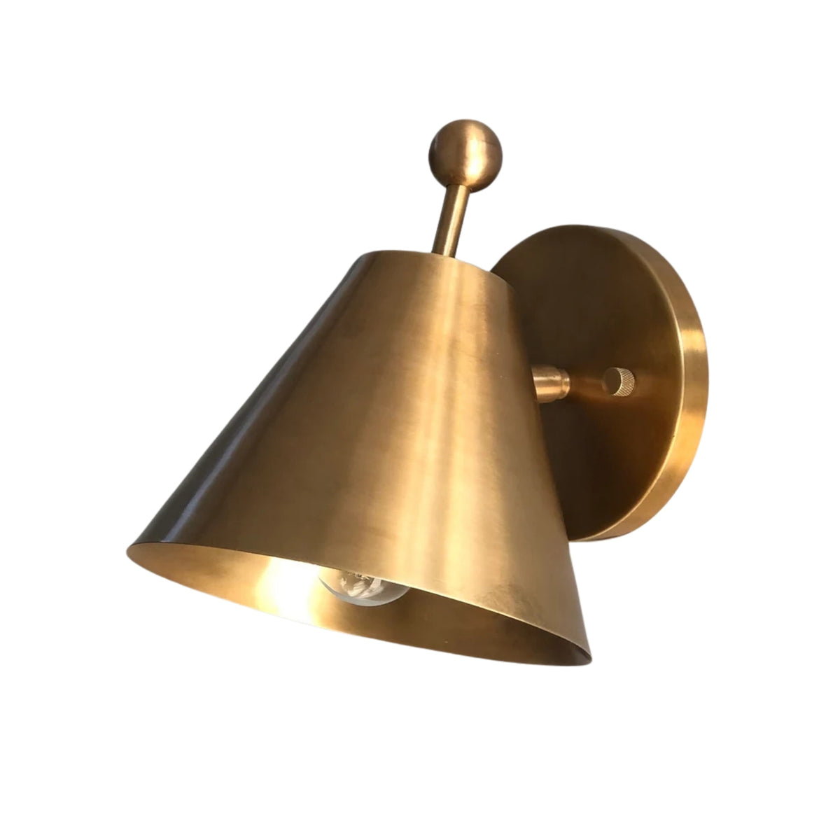 Side perspective of the Aurora satin brass tapered wall sconce highlighting the cone shade, round backplate, and minimalist design.