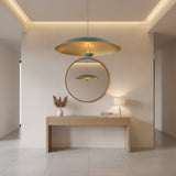 Aurora 3 light patina dome chandelier illuminated with warm light reflecting from the brass interior.