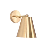 Angled view of the Aurora satin brass tapered wall sconce showcasing the tapered brass shade, round backplate, and clean contemporary profile.
