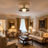 Detailed view of Aurora 18 inch aged brass flush mount with scalloped dome shade and frosted glass globe
