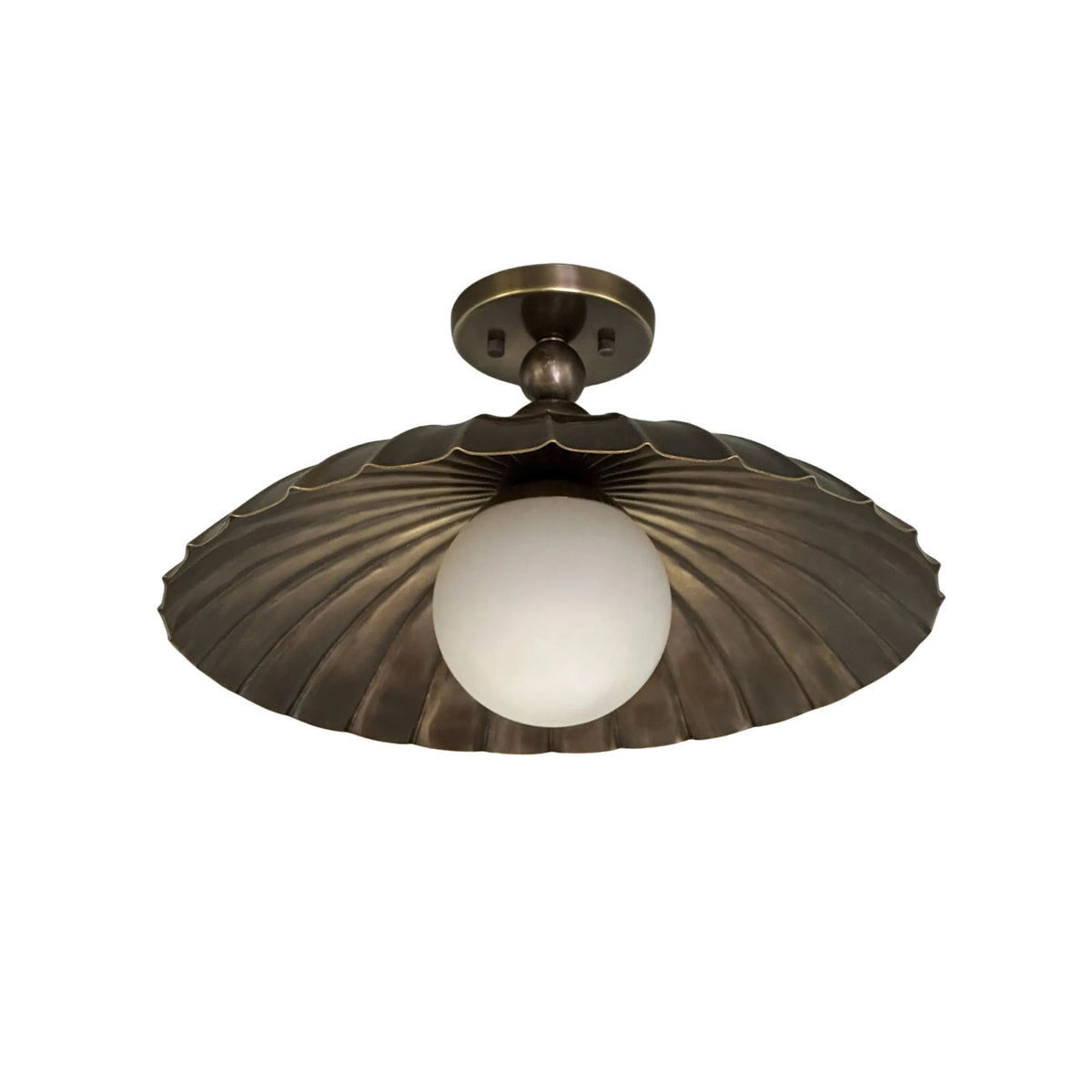 Close view of Aurora scalloped dome ceiling fixture with decorative brass accents and opal glass globe