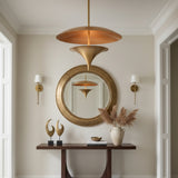 Angled view of Aurora sculptural brass chandelier showing its layered dome and tapered lower reflector, Model 62036.