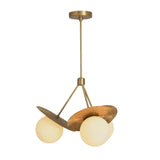 Angled view of Aurora 3-light chandelier featuring opal glass globes, textured petal accents and brass-toned frame.