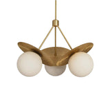 Front view of Aurora 3-light brass chandelier with three opal glass globe shades and sculptural fluted petal details.