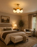 Aurora 3-light brass petal semi-flush chandelier installed in an elegant warm-toned bedroom interior