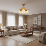Aurora 3-light brass petal semi-flush chandelier with illuminated opal glass globe shades