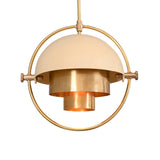 Aurora pendant chandelier featuring cream dome shade, layered brass cylinder and circular brass frame