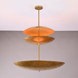 Angled view of Aurora Triple Saucer Chandelier showing sculptural three tier shade arrangement.