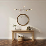 Austin 6 light sculptural chandelier shown from an alternate front angle highlighting its branching arms and exposed decorative bulbs.