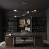 Austin 6 light Sputnik chandelier shown from an angled view with polished silver-tone arms and an asymmetric Mid-Century Modern design.