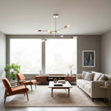 Austin 6 light Mid-Century Modern Sputnik chandelier shown from the front with exposed bulbs and polished silver-tone multi-directional arms.