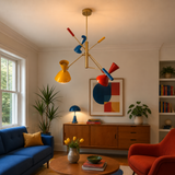 Bangkok 6 light multicolor chandelier displayed in a Mid-Century Modern living room with vibrant red, blue and yellow accents.