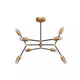 Berlin 8 light black and brass linear arm chandelier shown from the front with exposed globe bulbs and geometric arms.