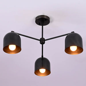 Modern 3-light black brass ceiling chandelier with dome-shaped shades, photographed in daylight against a white ceiling.