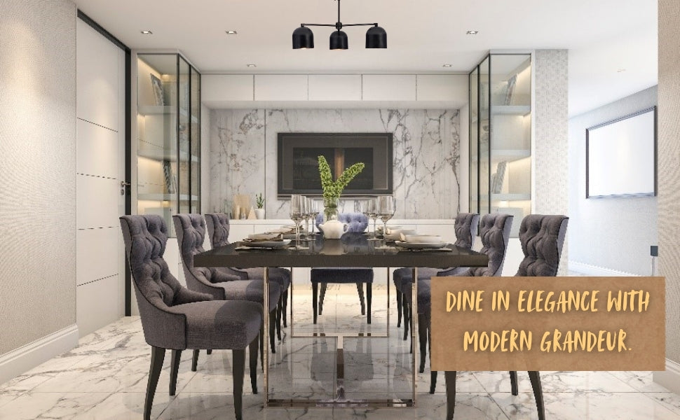 Elegant black 3-light chandelier hanging over a modern marble dining table setup with grey chairs, captioned “Dine in elegance with modern grandeur.”
