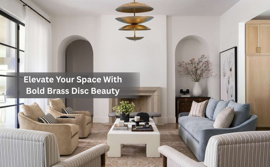 Modern living room with bold tiered brass disc chandelier hanging above a central coffee table, styled for minimal yet luxurious ambience