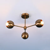 Modern ceiling light fixture with three spherical bulbs on a gradient background