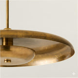 Detailed view of handcrafted brass disc chandelier rim highlighting brushed finish and natural patina texture.