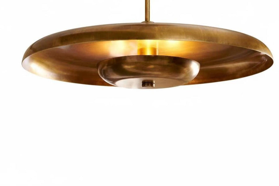 Sculpted brass disc chandelier with indirect ambient glow and slim downrod, handcrafted in brushed brass by Brass Leaf Studio.