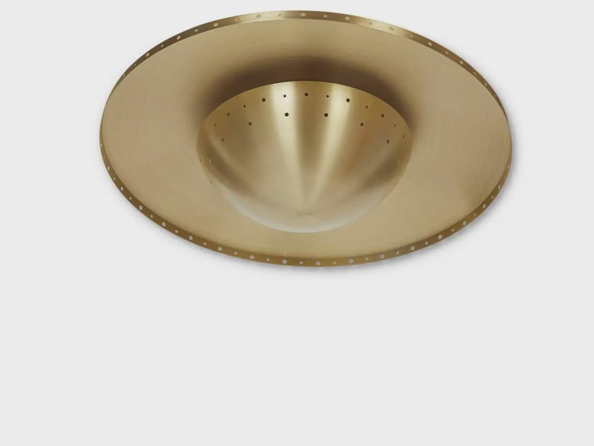 Side profile of brass disc flushmount ceiling light showing slim silhouette and solid brass construction.