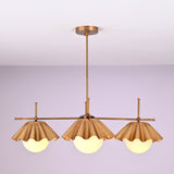 Handmade brass chandelier with three sculpted ruffled bowl shades and frosted globe bulbs, modern ceiling light for elegant interiors.