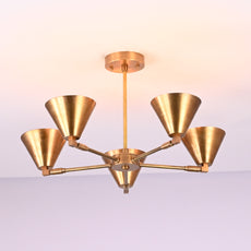 Modern brass chandelier with five upward cone shades in brushed golden finish, mounted on ceiling rod.