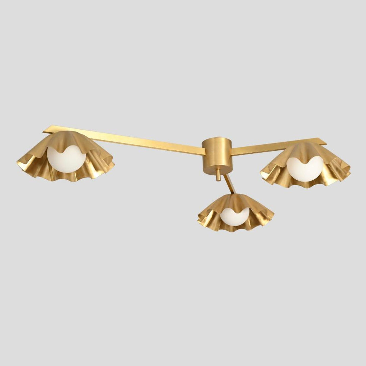 Minimalist brass chandelier with three scalloped ruffled shades, offering a blend of artistic design and warm ambient lighting.